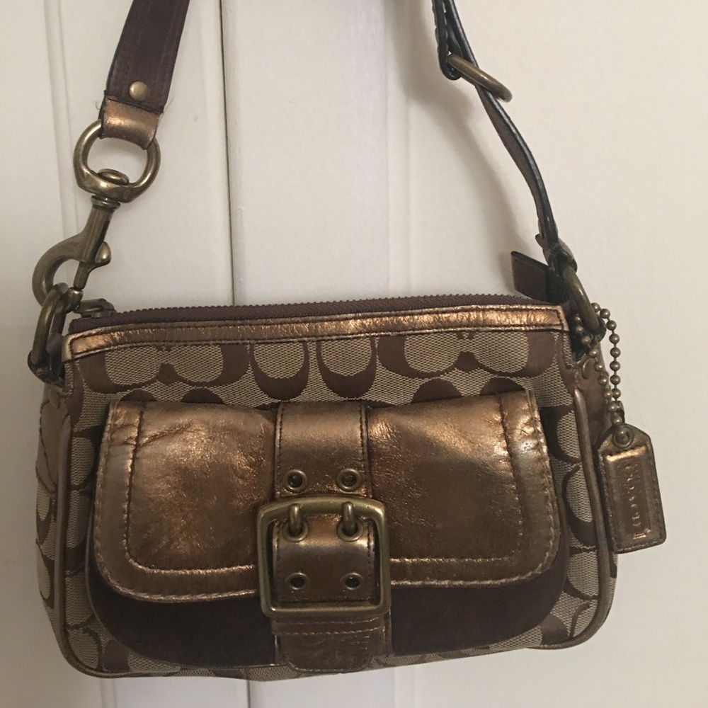Small coach bag with hardware gently used